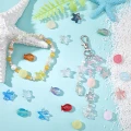 KSZ81 Koraliki szklane MORSKIE OCEAN rybka rozgwiazda muszelki 12szt