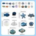 KSZ117 Koraliki szklane MORSKIE OCEAN rybka rozgwiazda muszelki 10szt mix