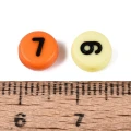 Koraliki literki monetki 7mm cyfry cyferki mix kolorów od 0 do 9 100sztuk