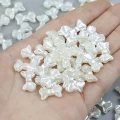 Koraliki akrylowe perłowe KOKARDKI kokardka 15mm kremowe coquette